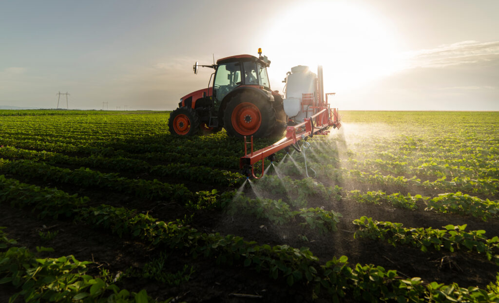 Tractor,Spraying,Pesticides,On,Soy,Field,With,Sprayer,At,Spring